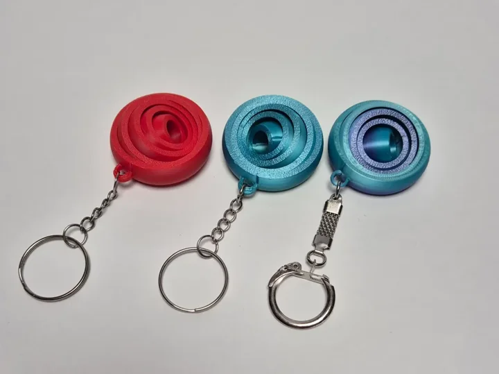 Chaveiro giroscópio (fidget) — referência do criador